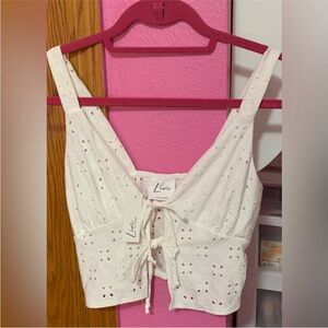 NWT. Livi by Olivia Rae. Size Small Eyelet white front top tie crop tank top.